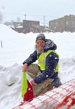 Volunteer Colin Trower looking happy in the snow while working the course. Photo credit DeAnne Gallegos
