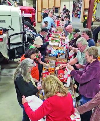Volunteers at the annual fire department candy sacking event. Photo credit Jerry Chambers