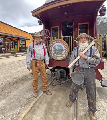 Roi Meiworm and Wayne Peterson of Durango came up to greet the train as miners. Photo credit DeAnne Gallegos
