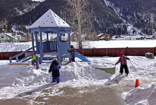 Photo credit Monica Watton The kids at SFLC playing on their snow-covered playground.
