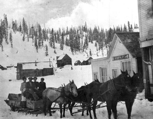 The mail sled at Red Mountain, with Art Stewart the driver in an undated photo, delivering mail and passengers. Photo courtesy of San Juan County Historical Society