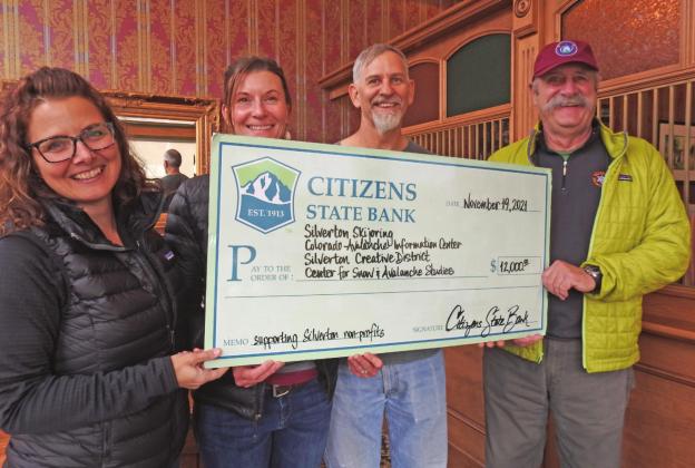 It is all smiles for the Silverton nonprofits that received funds from the San Juan County Community Fund. Pictured (left to right) Lisa Branner, Karen Srebacic-Sites, Wes Berg, and Keith Roush. Photo Credit Judy Zimmerman