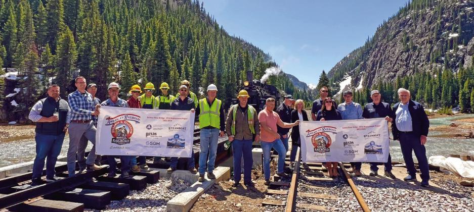 VIP group, Harper Family, DSNGRR leadership and rail crew all celebrate the inaugural steam train over the newly constructed Animas Bridge just south of town. Photo credit DeAnne Gallegos